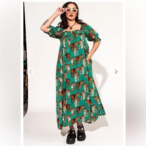 Dressed in Lala smocked dress in tiger tales